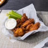 10 Wings · 10 wings rolled into the flavor of your choice sauce, with ranch or blue cheese.