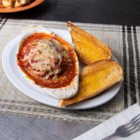 Lasagna (Always as Classic) · Layers of seasoned ricotta, mozzarella, sliced meatballs crumbled sausage baked in our marin...