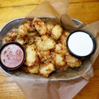 Cheese Curds · Wisconsin beer battered white cheese curds. Served with marinara and Parmesan ranch.