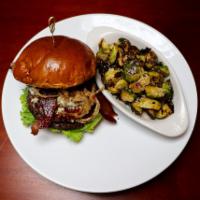Bourbon Blue Hand Held · 1/2 lb. burger, bourbon BBQ, lettuce, tomato, candied bacon, blue cheese, topped with crispy...