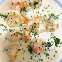Creamy Garlic Shrimp · Marinated shrimp grilled and sauteed in a buttery cheesy and garlic sauce.
