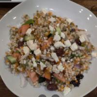 Mediterranean Salad · Couscous mixed with tomatoes, cucumbers, red onions, green peppers and olives topped with fe...