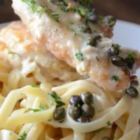 Chicken Piccata  · Chicken breast with sautéed capers in a light lemon olive oil sauce served over fettuccine p...