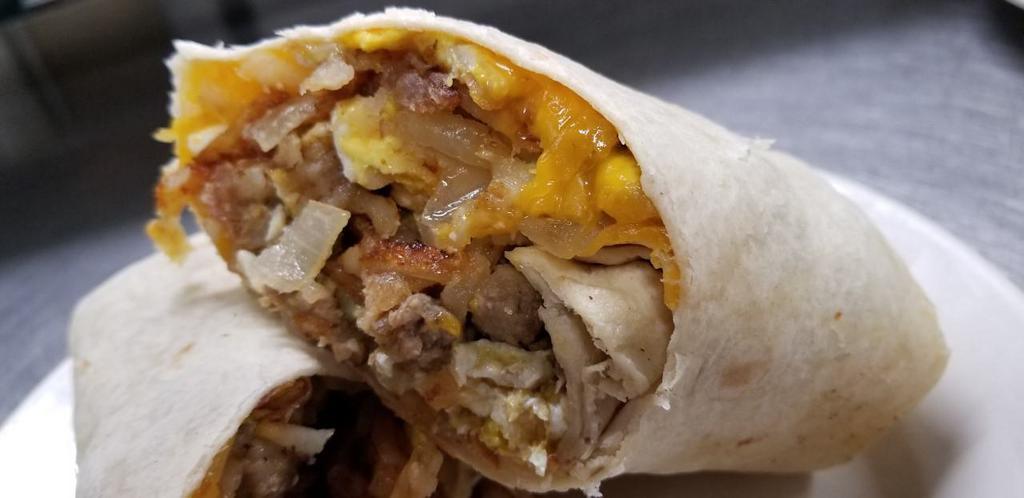 Hearty Breakfast Wrap · Bacon, Sausage, Fried Eggs, Cheddar Cheese, Sautéed Onions & Hashbrowns. *Served All Day