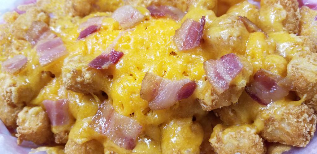 Loaded Tots · Tatar Tots, Bacon, Cheddar Cheese & Sour Cream.
