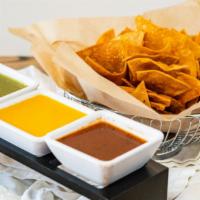 House Made Seasoned Chips with Trio of Chef's Salsas · Salsa verde, salsa fresca, & spicy habanero.