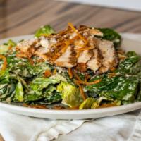 Roasted Chicken Cesar Salad · Little gem lettuce, fried tortilla strips, Parmesan cheese, house made Cesar dressing, and r...