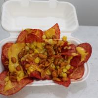 Papas Lokas · Spicy chips covered with Parm cheese,nacho cheese, corn and nuts.