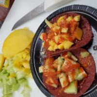 Fruit Tacos · 3 tamarindo tortillas with your choice of: mango, cucumber, tajin, strawberry, chamoy, pinea...
