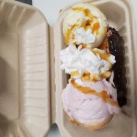 Gansito split · Gansito chocolate covered bread split in half with 2 scoops of ice cream. With whipped cream...