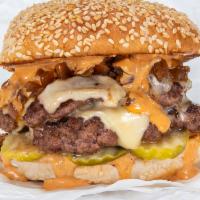 Double Smash Burger · Two smashed Creekstone Farms beef patties, white american cheese, pickles, diced onions, car...
