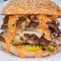 Triple Smash Burger · Three smashed Creekstone Farms beef patties, white american cheese, pickles, diced onions, c...