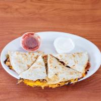 Chicken Quesadilla · Grilled chicken, cheddar and mozzarella cheese, peppers, onions on a tortilla. Side of salsa...
