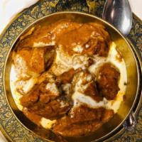 Butter Chicken · Punjabi-style tandoori chicken in a buttery tomato cream sauce.
