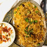 Lamb Biriyani with Raita · Basmati rice cooked with saffron, herbs, and lamb. Served with raitha - yogurt mixed with cu...