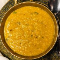 Yellow Dal Tarka · Yellow lentils seasoned with garlic, cumin and cilantro.