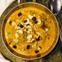Vegetable Korma · Seasonal vegetables and mild spices cooked in coconut milk.