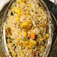 Indian Fried Rice · Cooked with a variety of vegetables and eggs.