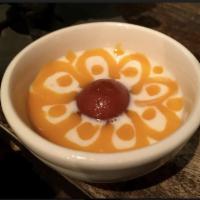 Assorted Dessert Selection · Combination of gulab jamun and rice pudding.
