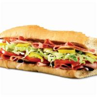 Classic Italian Sub · Pepperoni, salami, capicola, ham, provolone, banana peppers, lettuce, tomatoes, onions, red ...