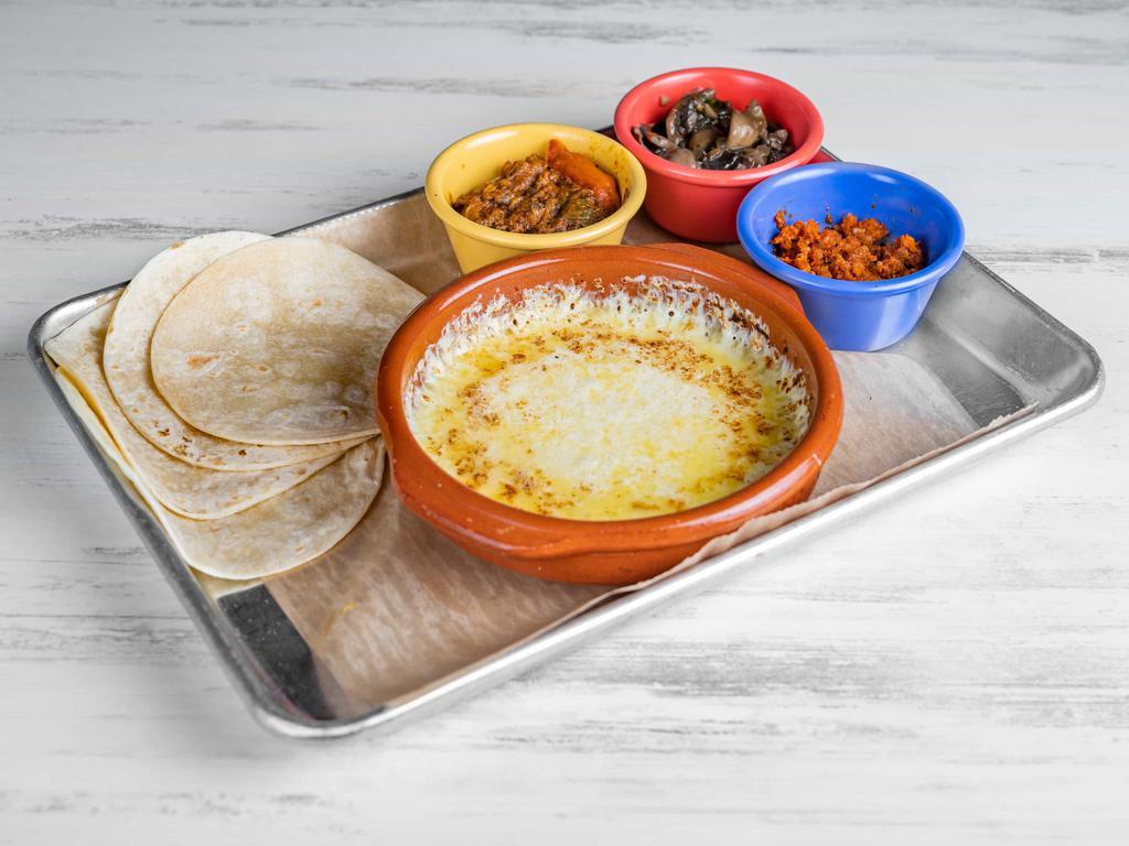 Queso Fundido · Mexican cheese blend, select your topping: plain-chorizo-mushroom.