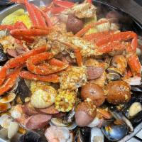 Happy Foursome Combo  · 2 lb. headless shrimp, 4 snow crab cluster, 2 lb. clam, 2 lb. black mussel, 1 lb. sausage, 4...