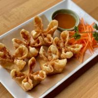 Cream Cheese Wonton · Crisp fried wontons stuffed with cream cheese served with house-made sweet and sour sauce