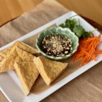 Fried Organic tofu · Crisp fried organic tofu accompanied by our sweet and sour dipping sauce and topped with roa...