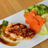 Grilled Ginger Salmon · Grilled 6 oz fillet of fresh Norwegian salmon topped with our savory teriyaki sauce, served ...