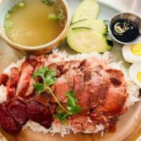 Roasted BBQ Pork · Roasted BBQ pork, with sweet sausage, boiled egg served on the bed of jasmine rice, with hou...