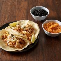 Tacos · 2 street-style tacos with our special cheese blend melted between two soft corn, two soft fl...