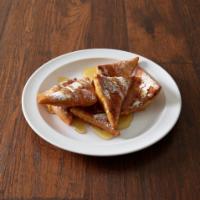 Sopaipillas · 6 pieces of puffed fry bread topped with honey, powered sugar and cinnamon.