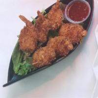 Coconut Shrimp · Butterflied coconut battered shrimp served with sweet chili sauce for dipping.