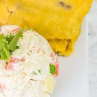Arepa De Perico · Corn arepa filled a scrambled omelet with tomatoes and onion.