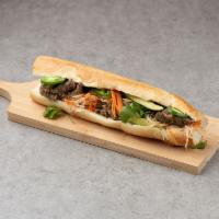 Banh Mi · Fresh baguette with cucumber, jalapeno, cilantro, pickled carrots and daikon and soy garlic ...