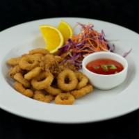 Fried Calamari · Crispy deep fried calamari and baby octopus with sweet chili mango sauce.