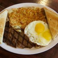 2. Steak and Eggs · Juicy beef steak, two eggs, hash brown, toast and jelly. 