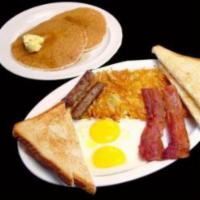 9. Breakfast Deluxe · Two pancakes, two eggs, two bacon strips, two sausages, hash brown, toast and jelly. 