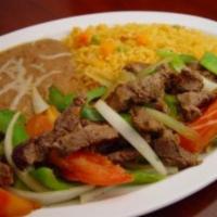 47. Steak Fajitas · Grilled strips of beef mixed with tomatoes, onions, and bell peppers. Served with rice, bean...