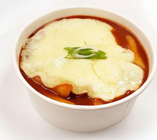 Cheese Spicy Rice Cake · Rice cake with Korean style spicy sauce with melted mozzarella cheese on top.