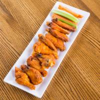 Chicken Wings · Choice of sauce. Served with celery, carrots and ranch dressing. Served with celery, carrots...