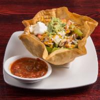 Fajita Salad · Marinated chicken or shrimp with sauteed onions and green peppers, tomatoes, chives, cheddar...