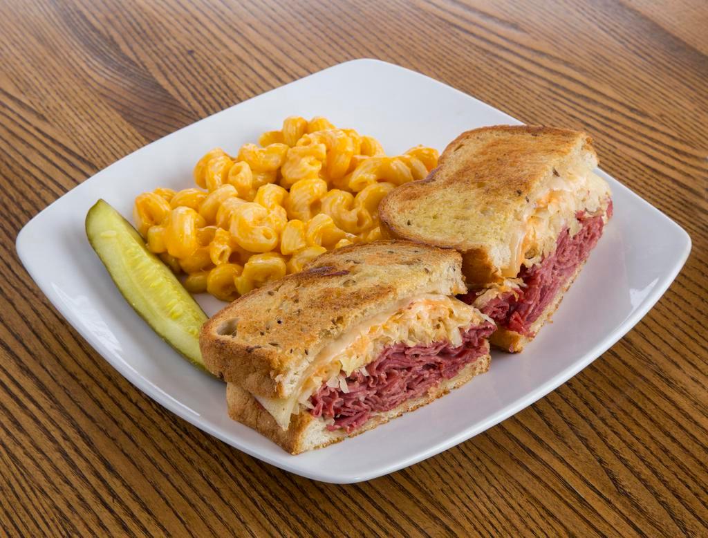 O’Sullivan’s Famous Grilled Reuben · Hot corned beef piled high on deli rye with sauerkraut, Swiss cheese and 1000 Island dressing.