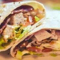 Fried Chicken Wrap · A fresh flour tortilla filled with a tender deep-fried chicken breast, melted cheese, choppe...