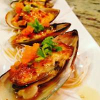 Baked Green Mussels · 6 pieces. New Zealand green mussels with dynamite sauce, masago and green onion.