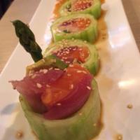 Nue Roll · 5 pieces. Tuna, salmon, yellowtail, avocado and asparagus wrapped in cucumber with ponzu sau...