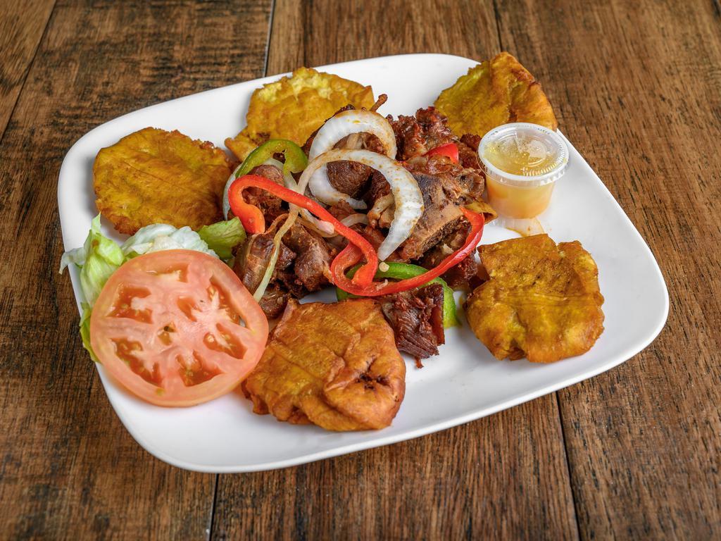 Tassot Dinde Complet ( FRIED TURKEY ) · Fried turkey. Marinated fried turkey served with rice, plantain and salad.
