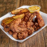 Zel poule (CHICKEN WINGS)  · Plain , Buffalo or BBQ wings. Served with fried plantains and salad.