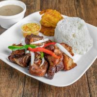 Griot (FRIED PORK) Complete · Fried pork. Marinated fried pork served with rice, plantains and salad.