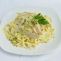 Chicken Pasta Alfredo · Fettuccine pasta in a rich Parmesan cheese and butter Alfredo sauce tossed with baked chicke...